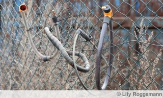 Fahrradschloss am Zaun